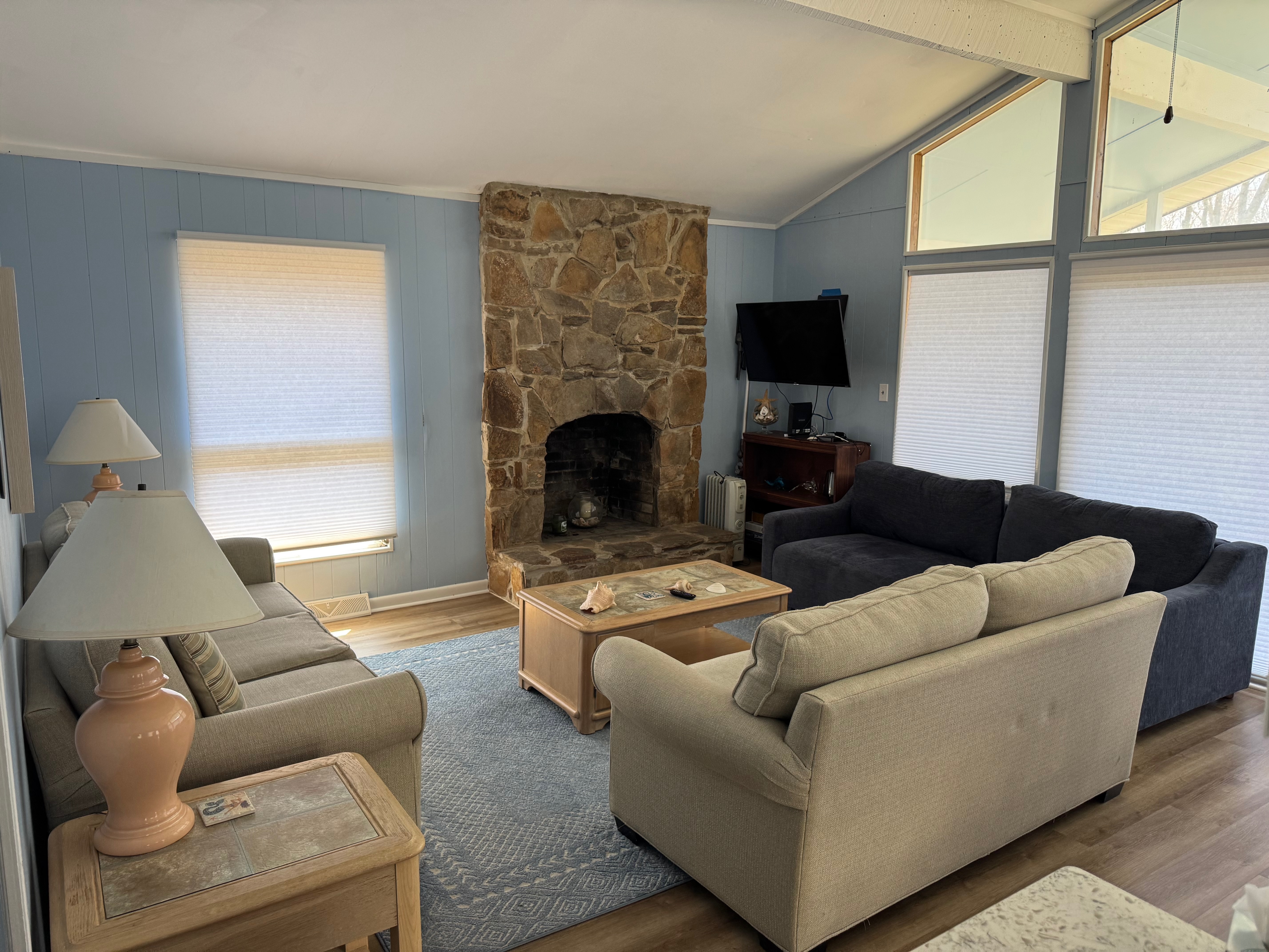 Living room with stone fireplace